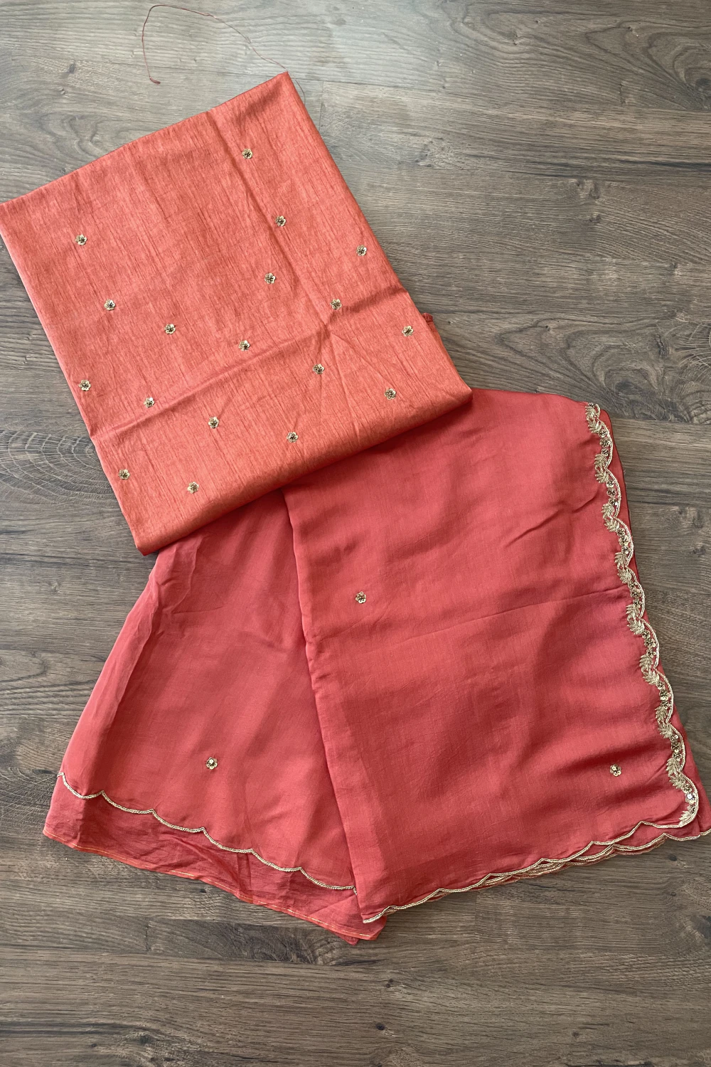 Rust orange muslin silk zardose handwork saree