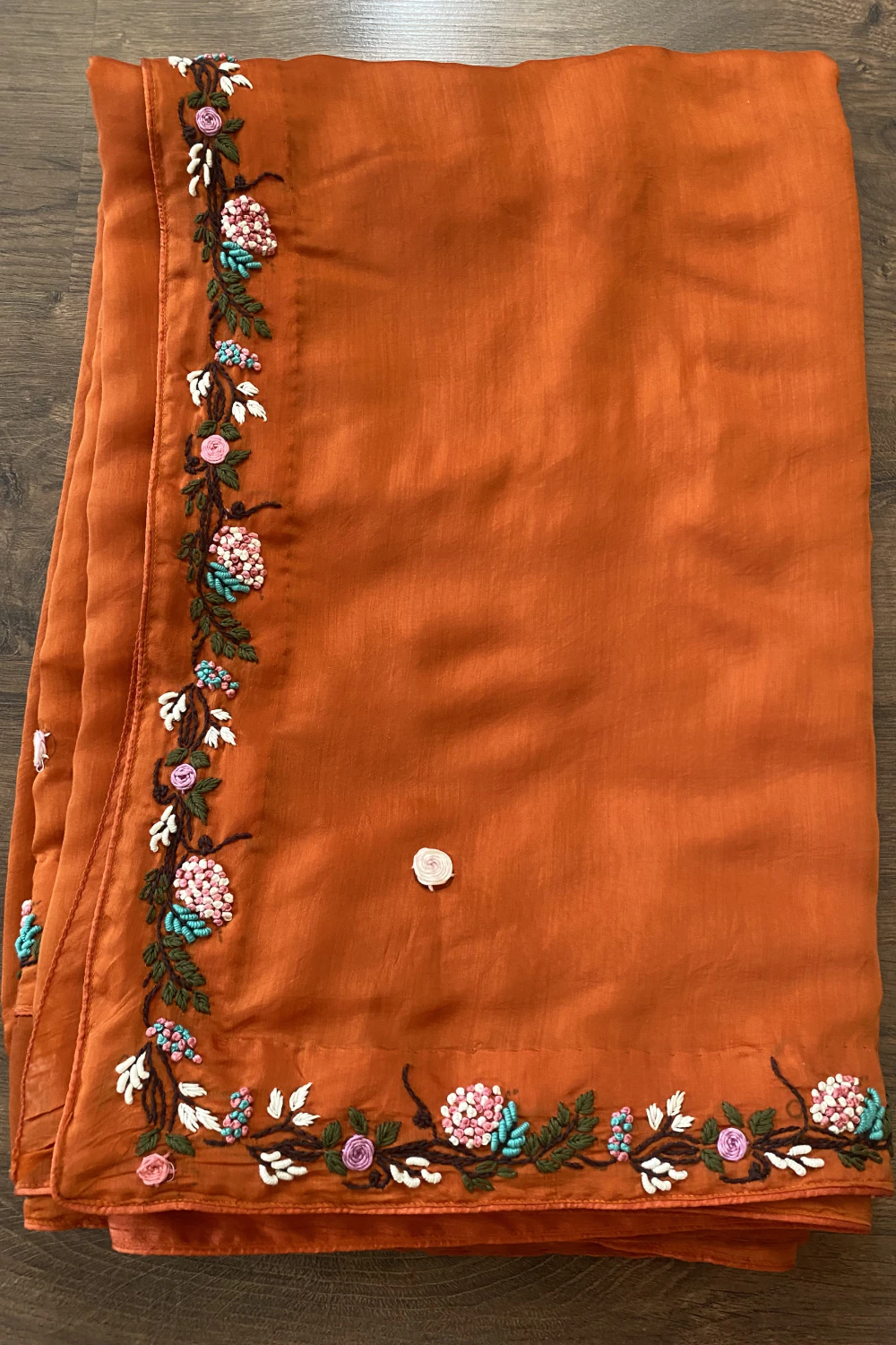 Rust orange thread work saree