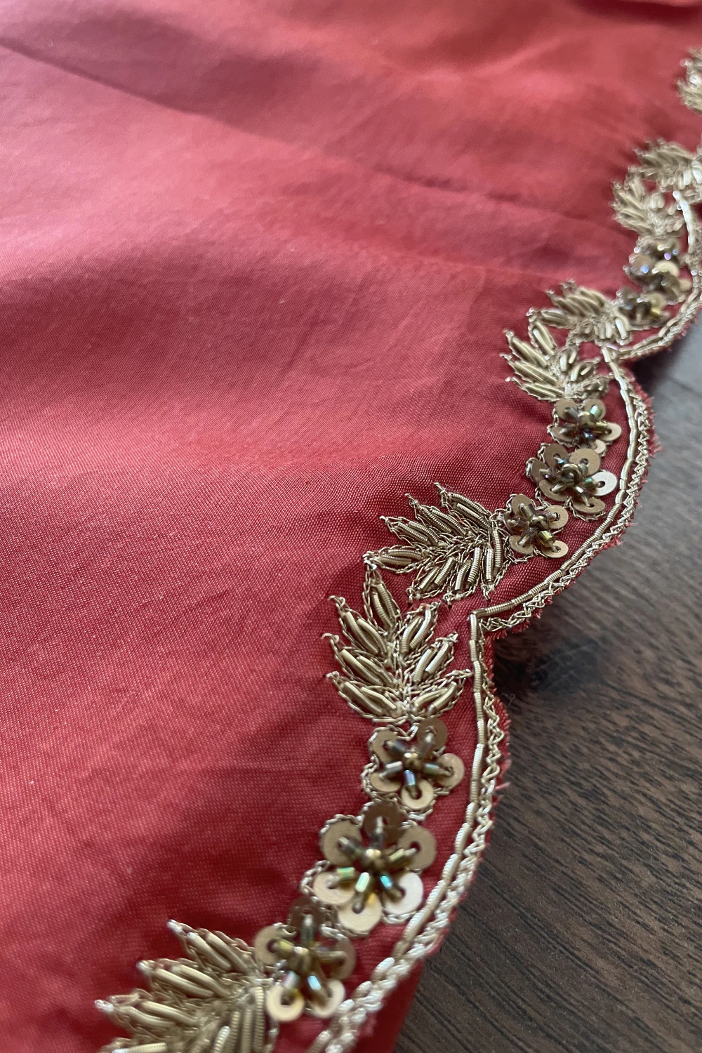 Rust orange muslin silk zardose handwork saree